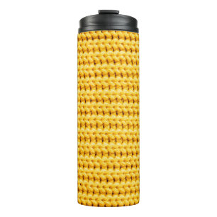Yellow knitted woolen fabric background thermal tumbler