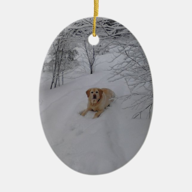 Yellow Lab Relaxing in Fresh Winter Snow Ceramic Ornament (Front)