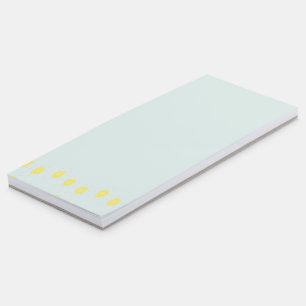 Yellow lemon slices on blue magnetic notepad