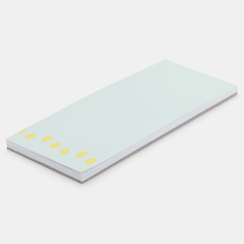 Yellow lemon slices on  blue magnetic notepad