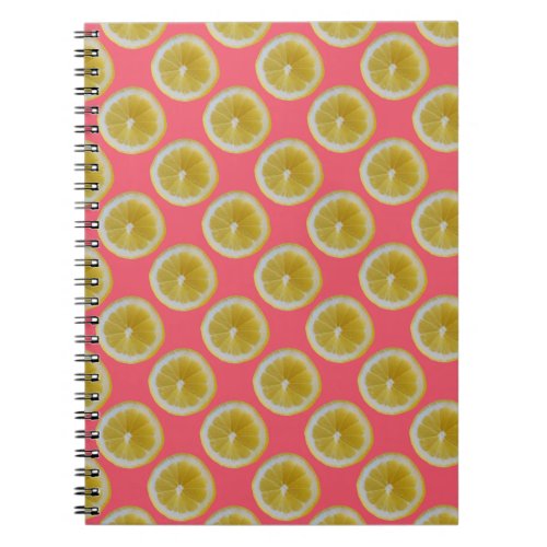 Yellow lemon slices on pink notebook