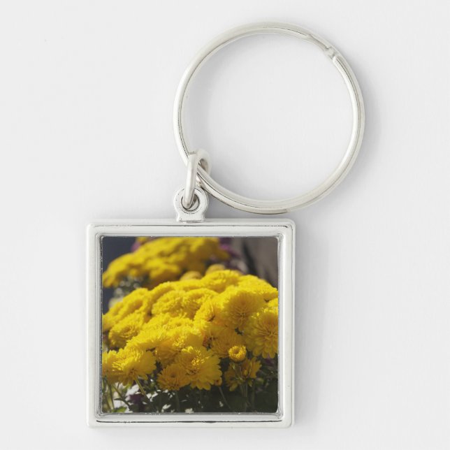 Yellow marigolds bask in sunlight keychain (Front)