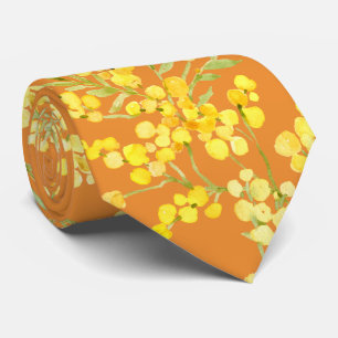 Yellow mimosa flowers on orange neck tie