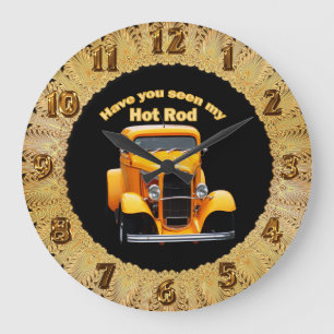 Yellow old roadster with the front windows chopped large clock