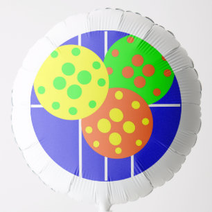 Yellow, orange, & green pickleballs on blue court balloon