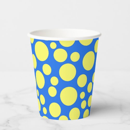 Yellow peas on a sky blue background paper cups