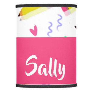 Yellow pencils and scrabbles on white lamp shade