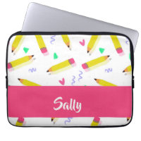 Yellow pencils and scrabbles on white laptop sleeve