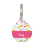 Yellow pencils and scrabbles on white pet ID tag