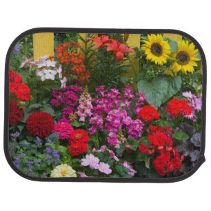 Yellow picket fence with flower garden in car floor mat