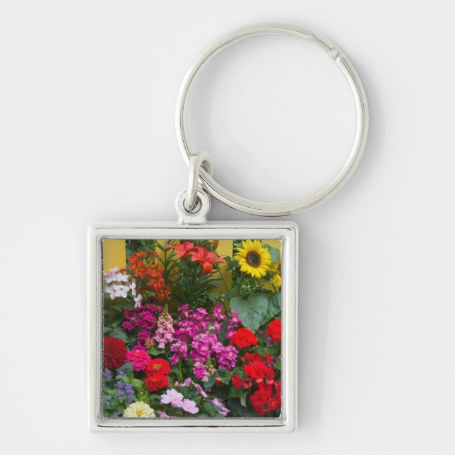 Yellow picket fence with flower garden in keychain (Front)