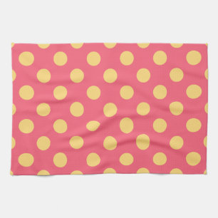 Yellow polka dots on coral towel