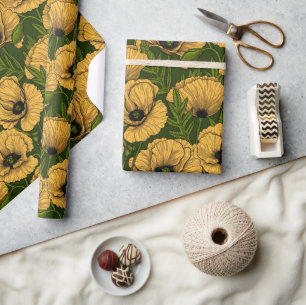 Yellow poppies on dark green wrapping paper
