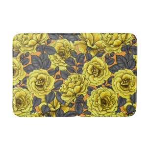Yellow roses with gray leaves on orange bath mat