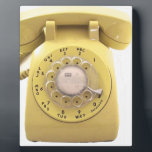 Yellow Rotary Phone Plaque<br><div class="desc">Share your digits with this classic design or simply celebrate your love of all things old school with this muted yellow classic style rotary telephone.</div>