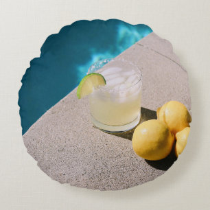 Yellow round fruits on gray table pillow