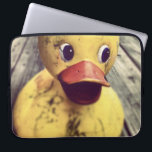 Yellow Rubber Ducky Needs a Bath! Laptop Sleeve<br><div class="desc">Cute and funny photo of a big yellow rubber ducky sitting on a wooden porch. This duck,  has a big red beak and wide staring eyes.  Covered in dirt,  perhaps waiting for the rain shower to wash away the dirt. Has a cute look on his face.</div>