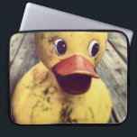 Yellow Rubber Ducky Needs a Bath! Laptop Sleeve<br><div class="desc">Cute and funny photo of a big yellow rubber ducky sitting on a wooden porch. This duck,  has a big red beak and wide staring eyes.  Covered in dirt,  perhaps waiting for the rain shower to wash away the dirt. Has a cute look on his face.</div>