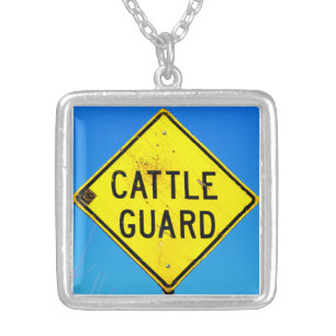 yellow sign on blue necklace