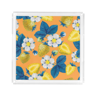 Yellow strawberries on orange acrylic tray