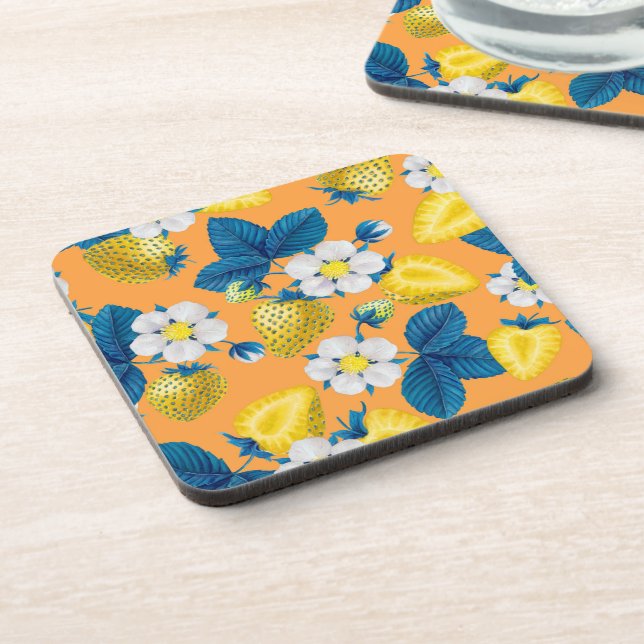 Yellow strawberries on orange beverage coaster (Left Side)