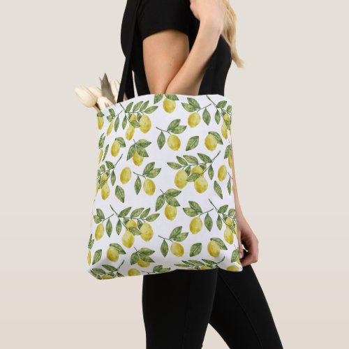 Yellow summer watercolor lemons with green leaves tote bag