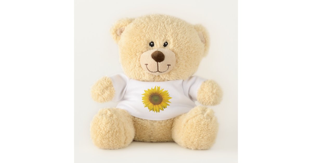 teddy bear holding a sunflower