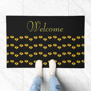 Yellow sunflowers on black doormat
