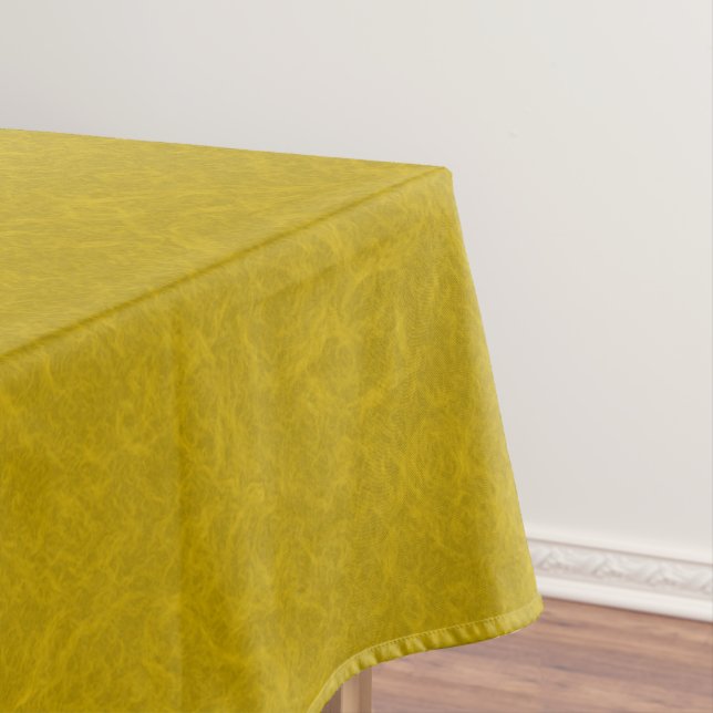 Yellow textured surface with  swirling pattern tablecloth (In Situ)