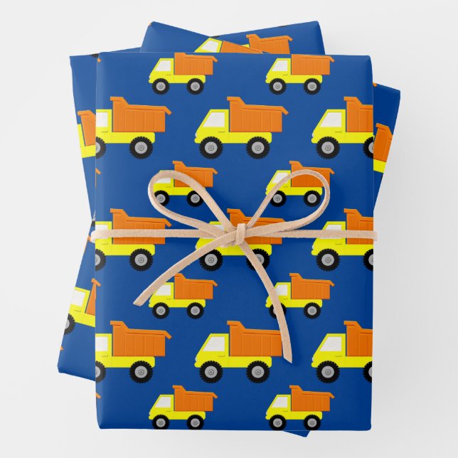 Yellow Toy Construction Truck On Blue Wrapping Paper Sheets (In situ)
