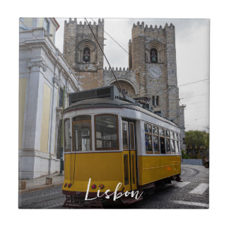 Yellow tram on Lisbon Cathedral in Portugal Ceramic Tile