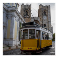 Yellow tram on Lisbon Cathedral in Portugal