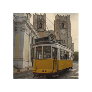 Yellow tram on Lisbon Cathedral in Portugal Wood Wall Art