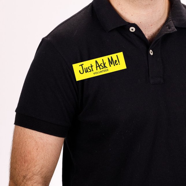 Yellow Volunteeer Ask Me Simple Name Tag (Man wearing black shirt with yellow "just ask me" volunteer name tag badge.)