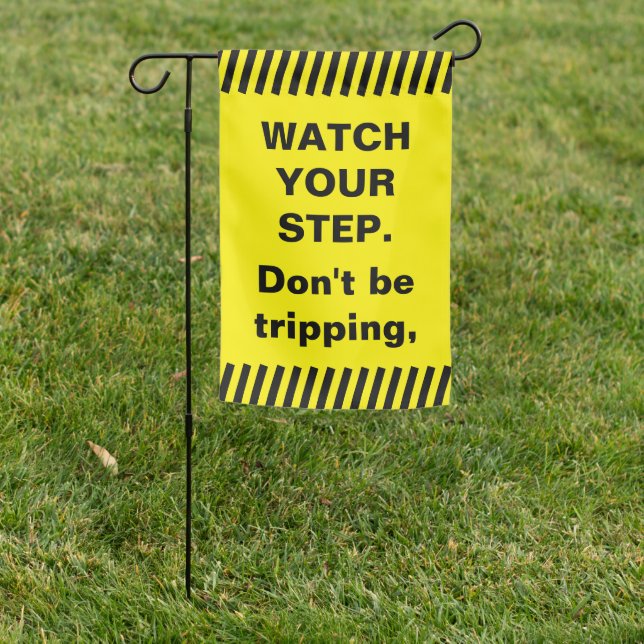 Yellow watch your step garden flag (In SItu)