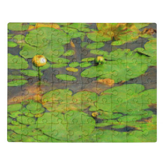 Yellow water lily blooming in the calm pound  jigsaw puzzle
