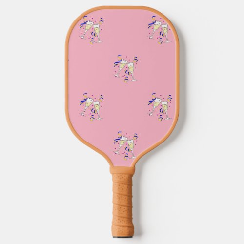 Yellow wine glasses on pink pickleball paddle