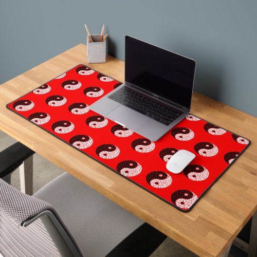 Ying yang pattern on red desk mat