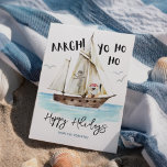 Yo Ho Ho Pirate Santa Christmas  Holiday Card<br><div class="desc">Ahoy! Add a little fun to the holidays with this nautical theme Christmas card featuring a watercolor pirate Santa drinking from a coconut, and pirate ship and jolly roger with "Aargh!" and "Yo Ho Ho" captions. The greeting (shown here with Happy Holidays), and signature name can be personalized... and you...</div>