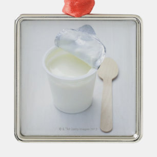 Yoghurt in opened disposable cup metal ornament