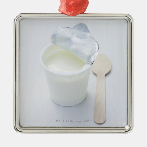 Yoghurt in opened disposable cup metal ornament