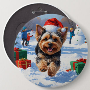 Yorkipoo Running in Snow with Christmas Hat Button
