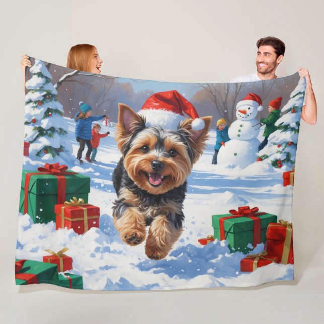 Yorkipoo Running in Snow with Christmas Hat Fleece Blanket (In Situ)