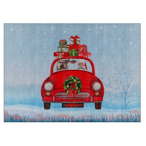 Yorkshire Terrier Dog In Car With Santa Claus  Cutting Board