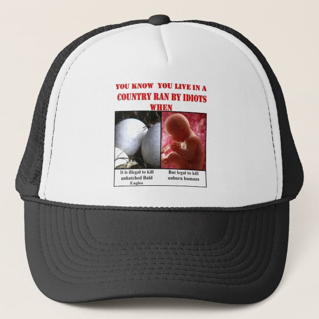 YOU KNOW YOU LIVE IN A COUNTRY RAN BY IDIOTS WHEN TRUCKER HAT (Front)
