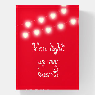 You light up my heart with strings of heart red paperweight