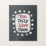 You Only Live Once YOLO Jigsaw Puzzle<br><div class="desc">Bold text reading "You Only Live Once" is centered against a gray background. The black text sits on a white rectangle with large textured white dots around it,  providing a playful contrast against the solid color backdrop.</div>