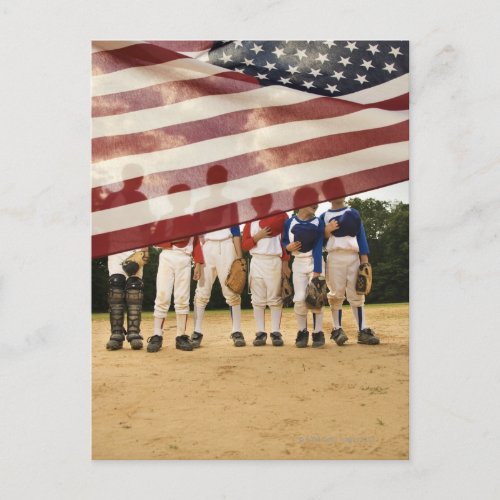Young baseball players partially hidden by postcard