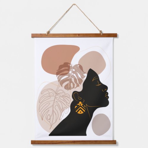 Young beautiful african american woman hanging tapestry