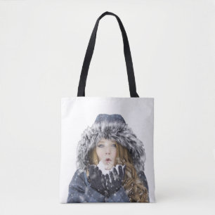 Young beautiful girl in winter tote bag